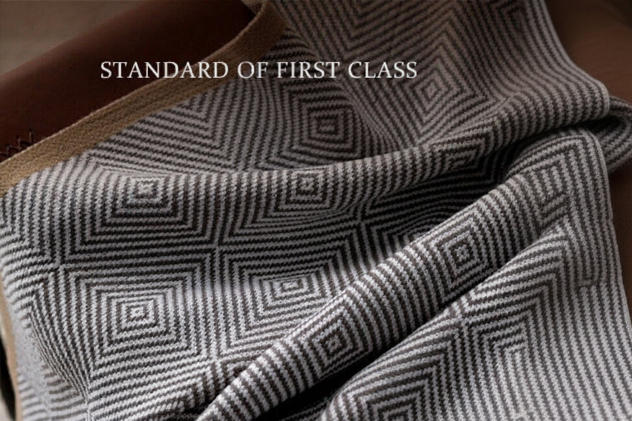 Textured fabric with geometric pattern and text overlay on a brown background